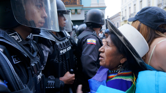 Carmen Lozano, President of the Women's Organization at ECUARUNARI, facing the police blockade at the August 27th march for the Yasuni in  Quito, Ecuador.